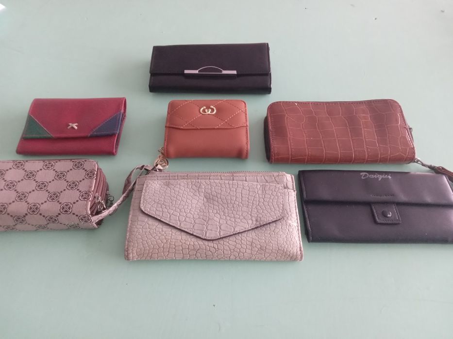 Гаманці нові і вживані.,блокноти