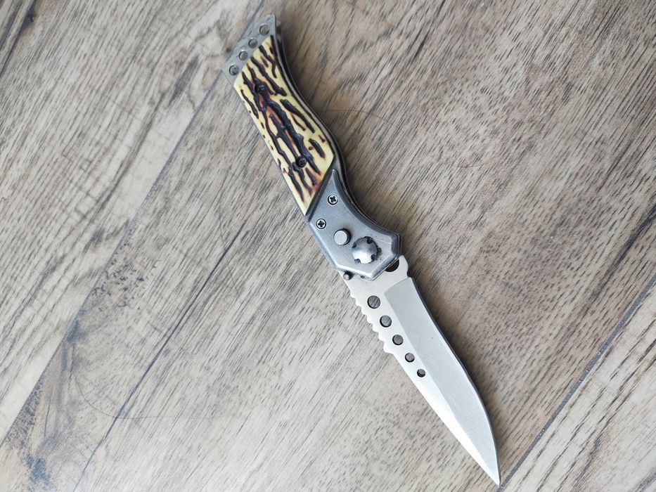 Nóż sprężynowy, składany