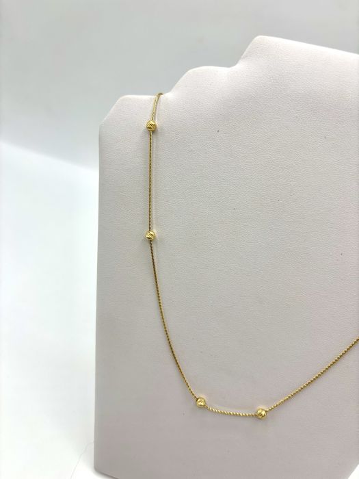 Złoty naszyjnik z kulkami rychomymi regulowany