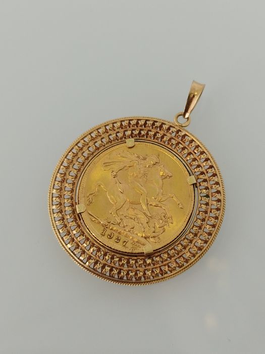 Medalha libra em ouro de 22kt com aro de 19,2kt