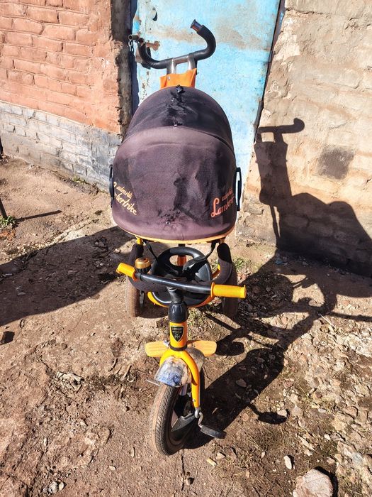 Трехколесный велосипед с родительской ручкой