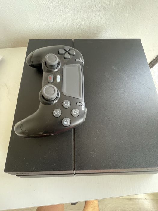 Vendo ps4 como nova + jogo The last of Us