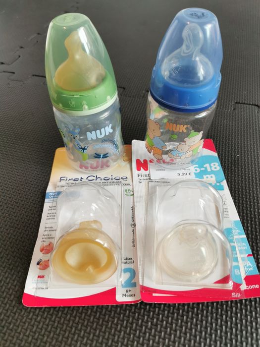 2 Biberões NUK + tetinas novas