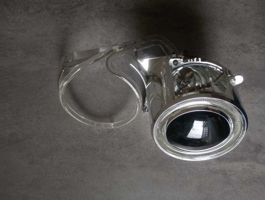 Soczewka reflektora bi-ksenonowego, ring angel eyes, silniczek regulacji wysokości reflektora BMW e90 e91