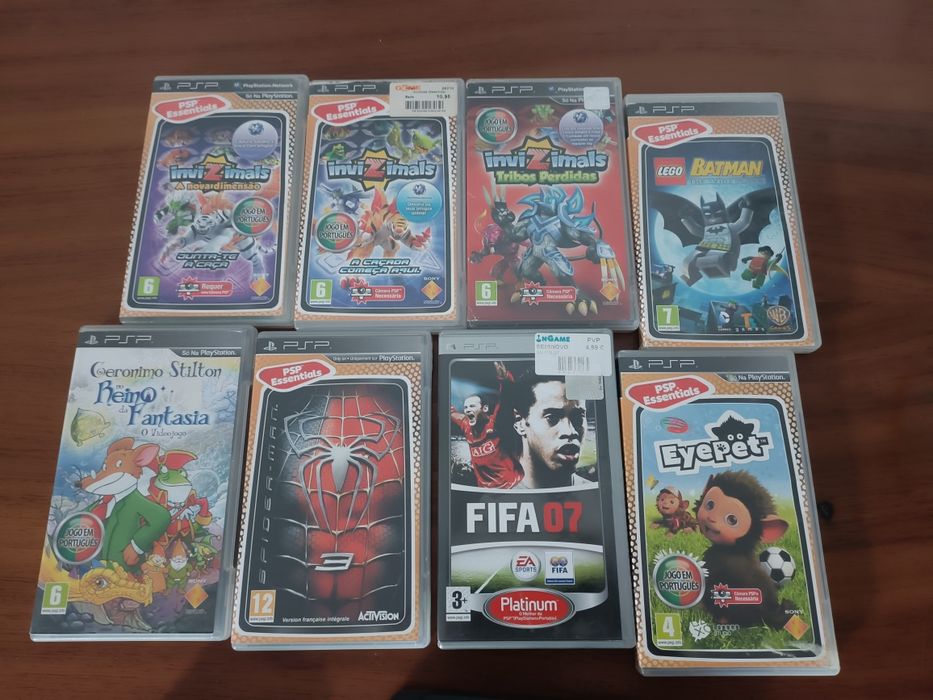 PSP  com carregador e 8 jogos