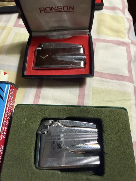 11 isqueiros 4 Dupont 1 Cartier 1 Dunhill 2 Ronson 2 Zippo 1 Zaima