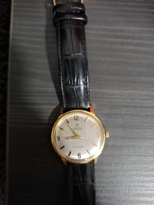 Omega złoto,stal