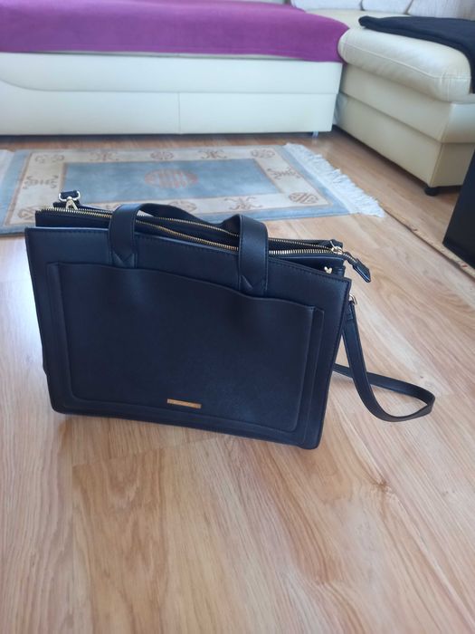 Nowa, czarna torba biurowa ze skory ekologicznej.