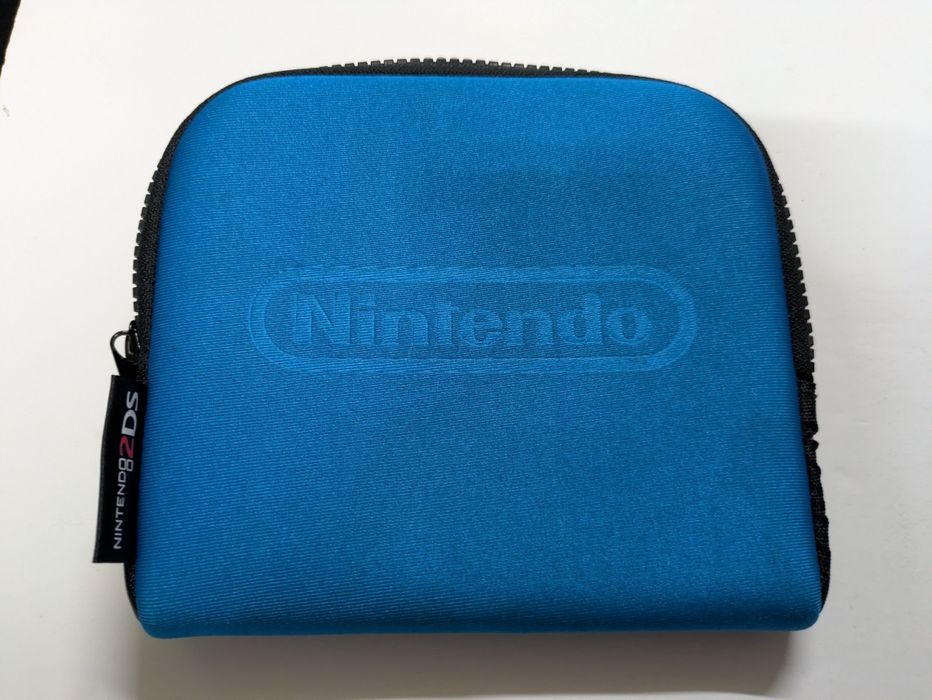 Nintendo 2DS (Super Mario Bros.2)
Super Mario Bros.2) pré instalado
Ca