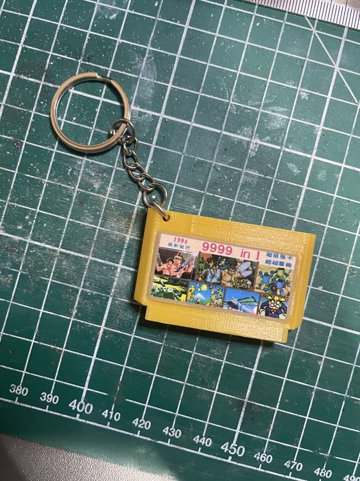 Брелок у вигляді коробки з іграми для xbox, nintendo, playstation 1-5.