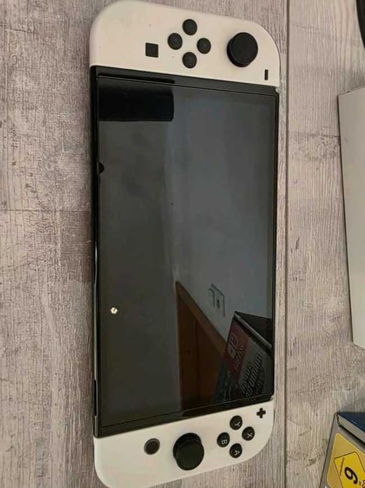 Nintendo Switch OLED Sprawne wszystko Z grą Mario bros