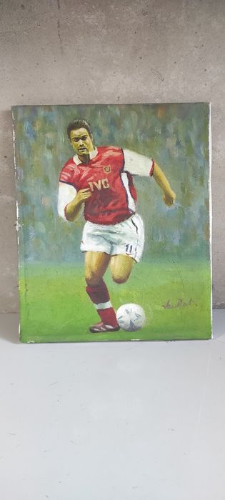 Arsenal Londyn. Piłkarz. Piłka. Obrazek  Premier Liga angielska