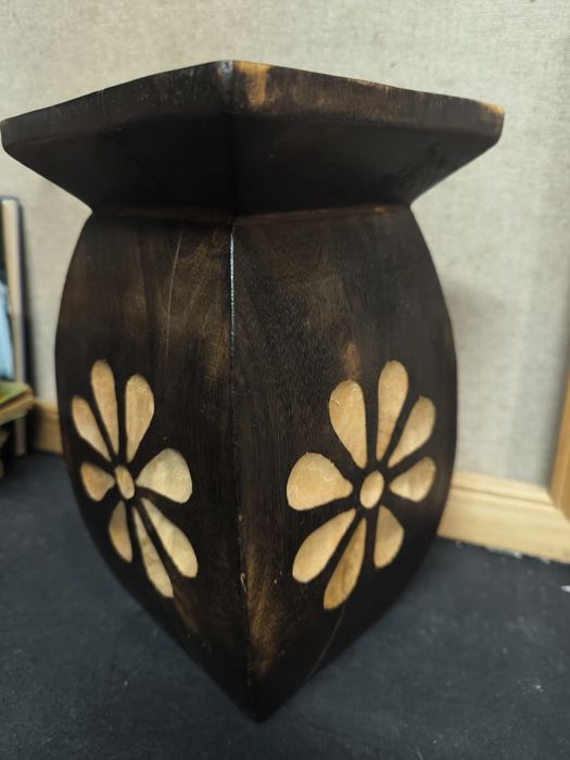 Rustic Wooden Vase with Floral Carvings
selling this piece d