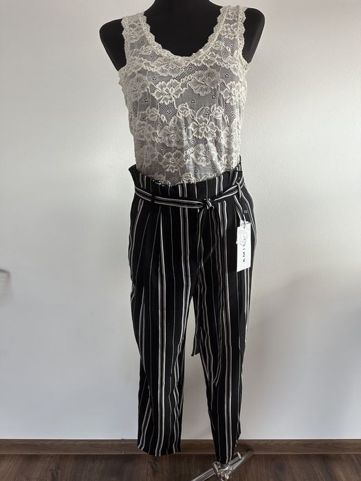 Spodnie zwiewne wiązanie kokardka pionowe paski czarne kuloty na lato