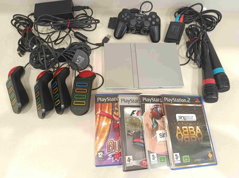 Playstation 2 SONY, comando Sony e para BUZZ, 2 microfones, cabos ligação TV e energia, 4 jogos