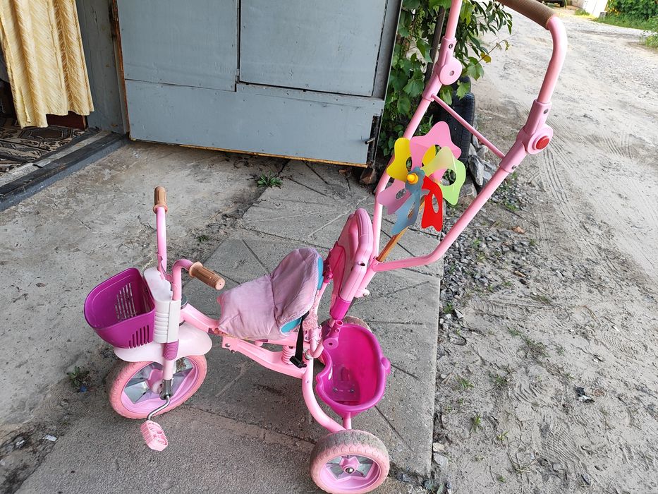 Детский розовый велосипед трёхколёсный