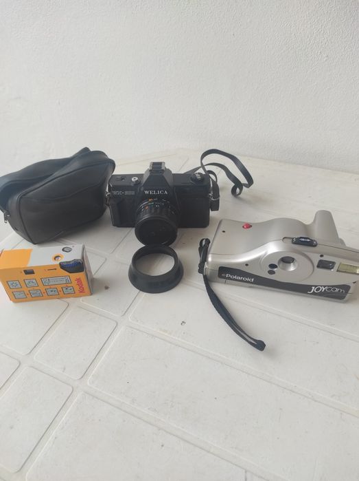 Conjunto de três máquinas fotográficas