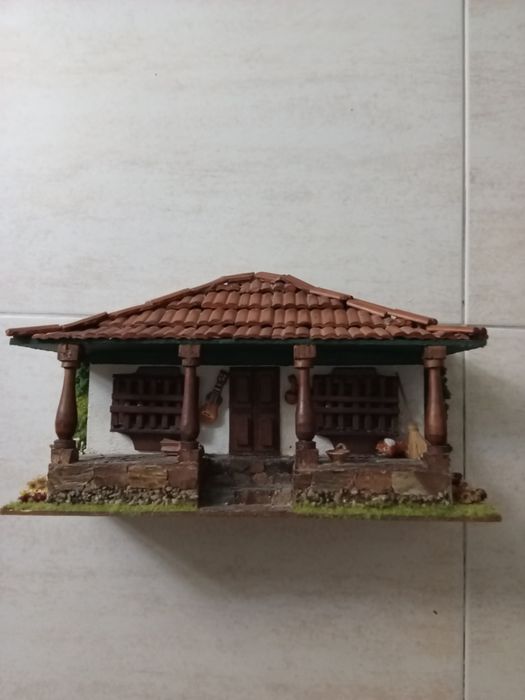 Miniatura de casa  rural latino americana em artesanato
