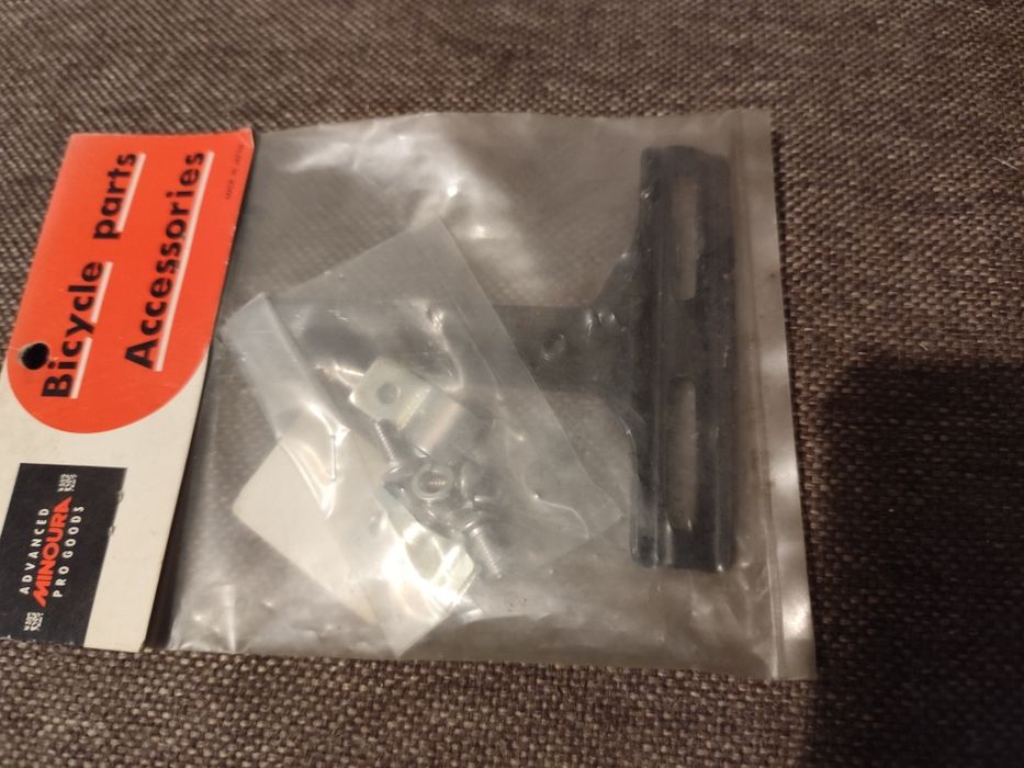 Nowy adapter do montażu koszyka do bidonu pod siodełkiem Minoura