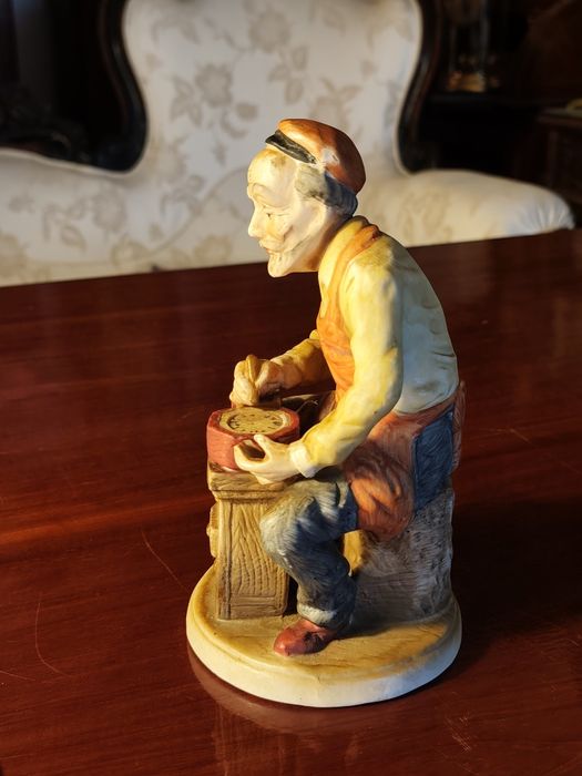 Figurka zegarmistrz