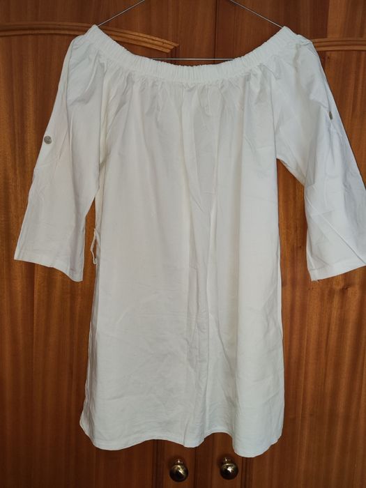 Túnica branca em barco