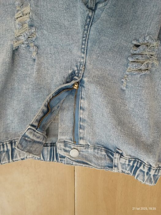 Spodnie dzwony z dziurami rozciągliwe dla dziewczynki rozm. 150