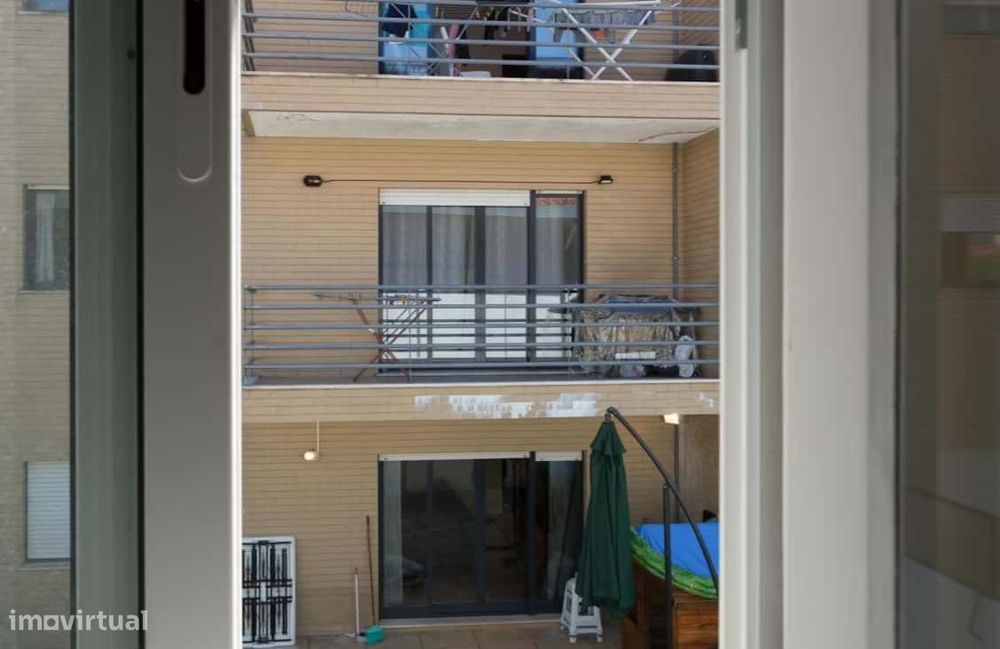 Superior room with shared bathroom and a sofa