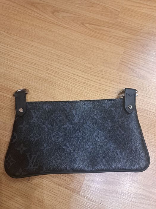 Сумка-клатч Louis Vuitton.