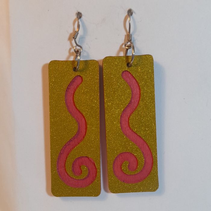 Wooden earrings with spiral design.