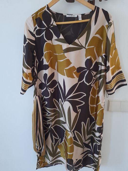 Vestidos e saias que fazem sobressair  elegância