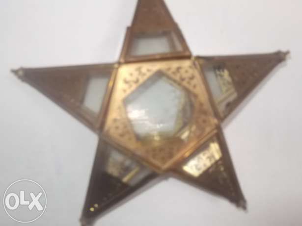 Peça iluminação para velas redondas em forma de estrela