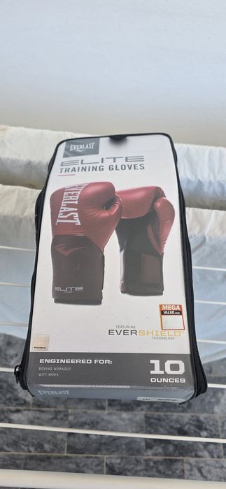 Kit Desportos de Combate: Luvas Boxe Everlast Elite 10oz + Caneleiras Outshock Tam. M