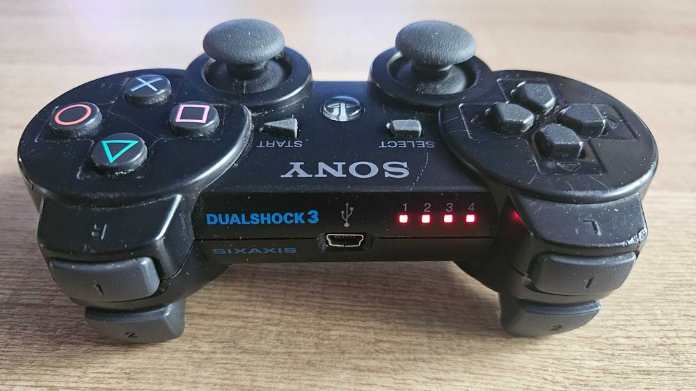 Sony PS3 Slim CECH-2004A 120GB + oryginalny DualShock 3 + 2 gry