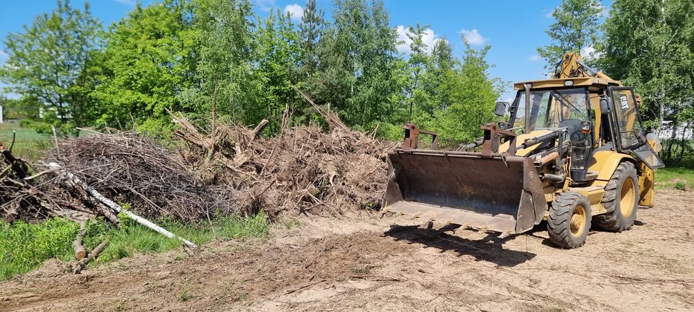 Usługi Koparko-ładowarka koparka  niwelacja pracę ziemne wykopy