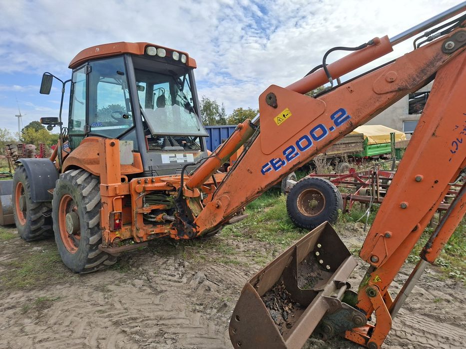 Koparkoładowarka New Holland LB 115. Fiat Hitachi FB200.2