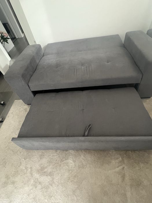 Sofa cama em tecido cinzento