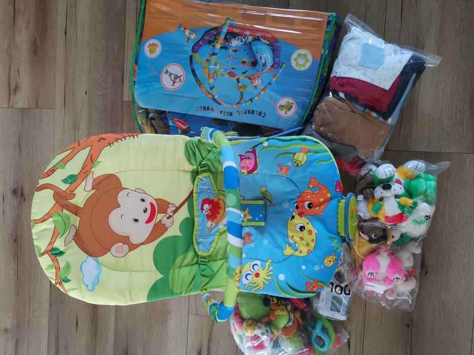 Mata edukacyjna,leżaczek,elektroniczna niania,ubranka 6-9mies,zabawki.