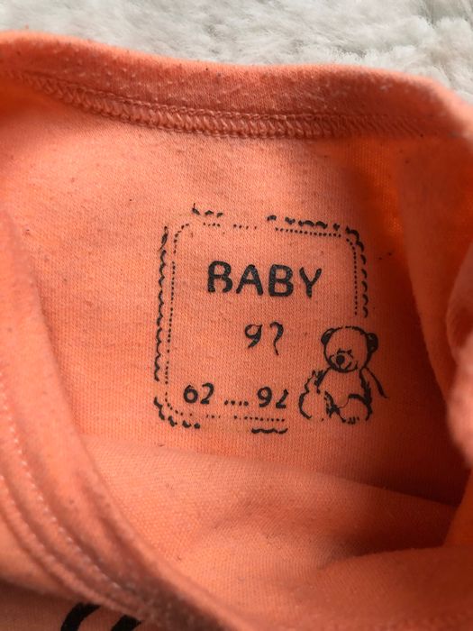 Pomarańczowe, bawełniane body z krótkim rękawem Baby