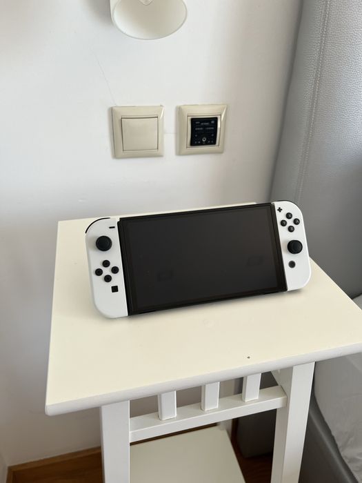 Latest Nintendo Switch model: Nintendo Switch OLED. +2 games