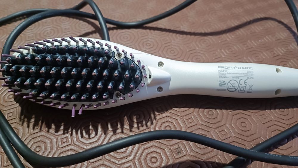 Escova de cabelo elétrico