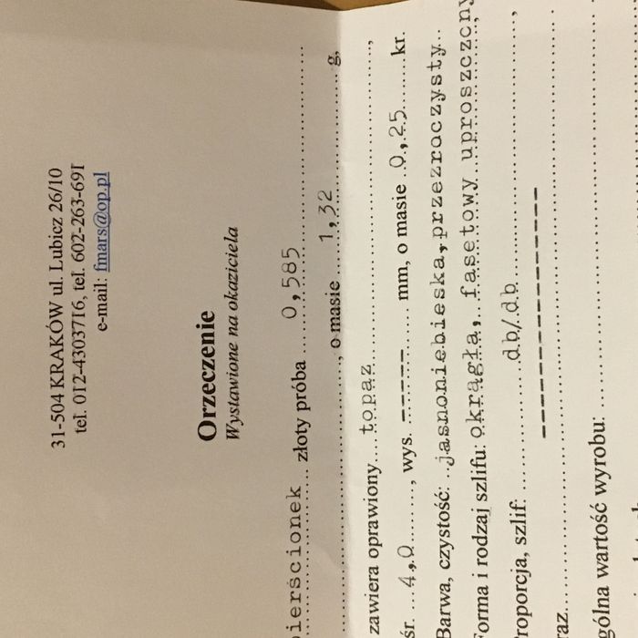 Złoty pierścionek z topazem