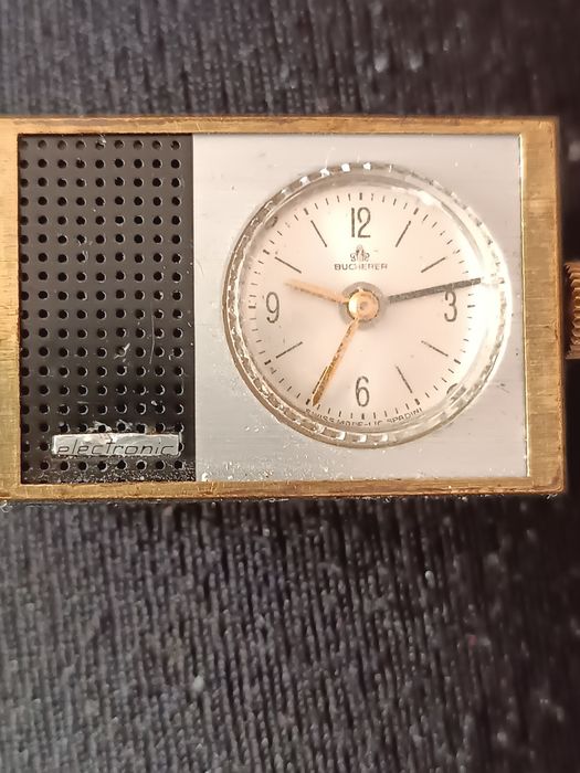 BUCHERER.Винтажный швейцарский будильник.,самым маленький электромехан