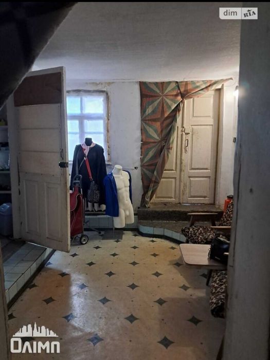Продам пів будинку в топовом місці на вул.Кармелюка 0962