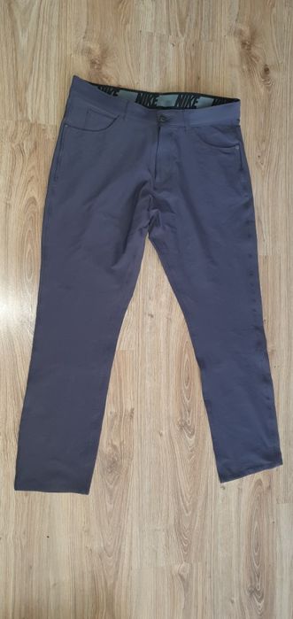 Eleganckie spodnie sportowe NIKE rozmiar M do golfa i inny sportów