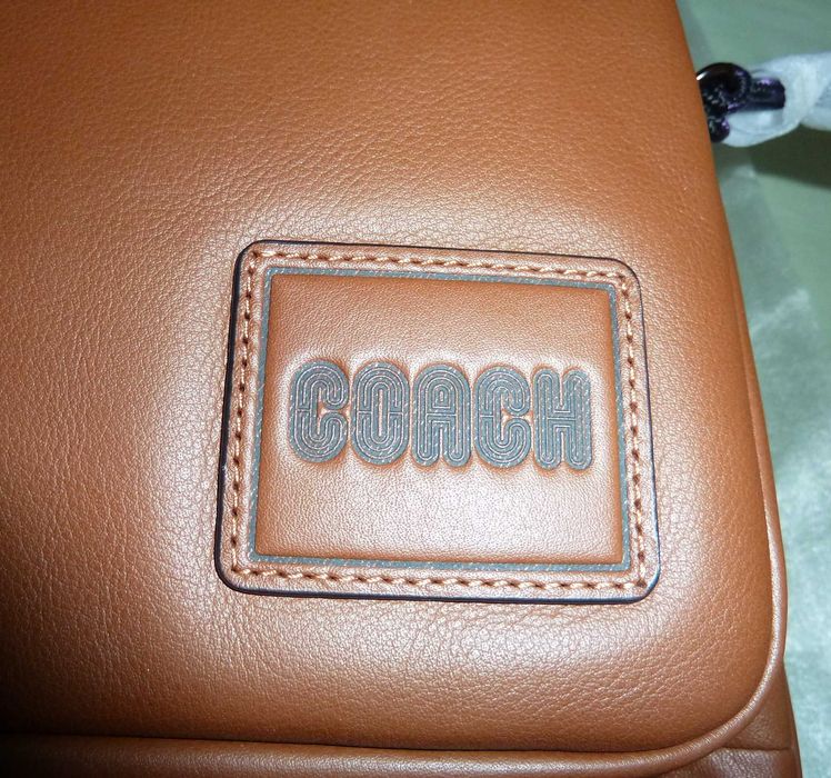 Mochila nova unissexo em pele Coach