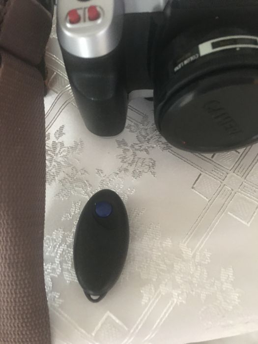Aparat fotograficzny z lampą , pilotem i torbą orginalną do sprzetu