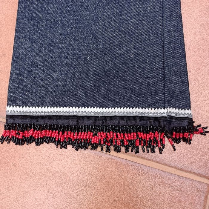 Calças de ganga extensível com missangas