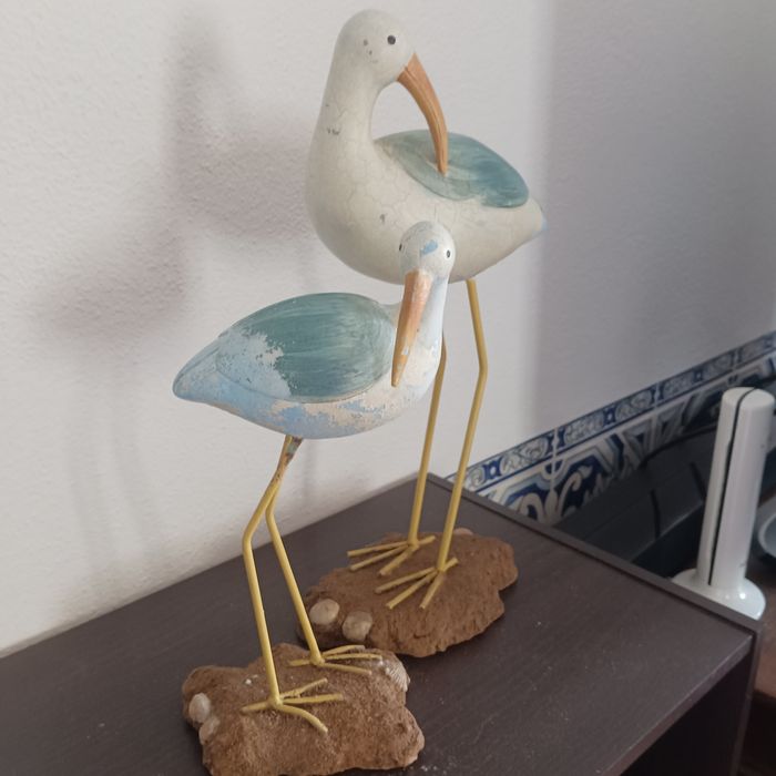 Estatuetas cegonhas