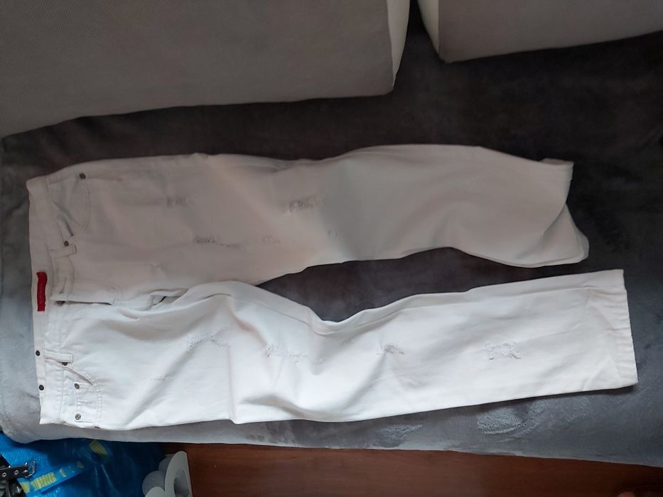 Jeansy damskie białe