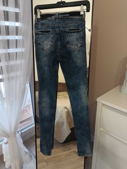 Damskie jeansy Reserved